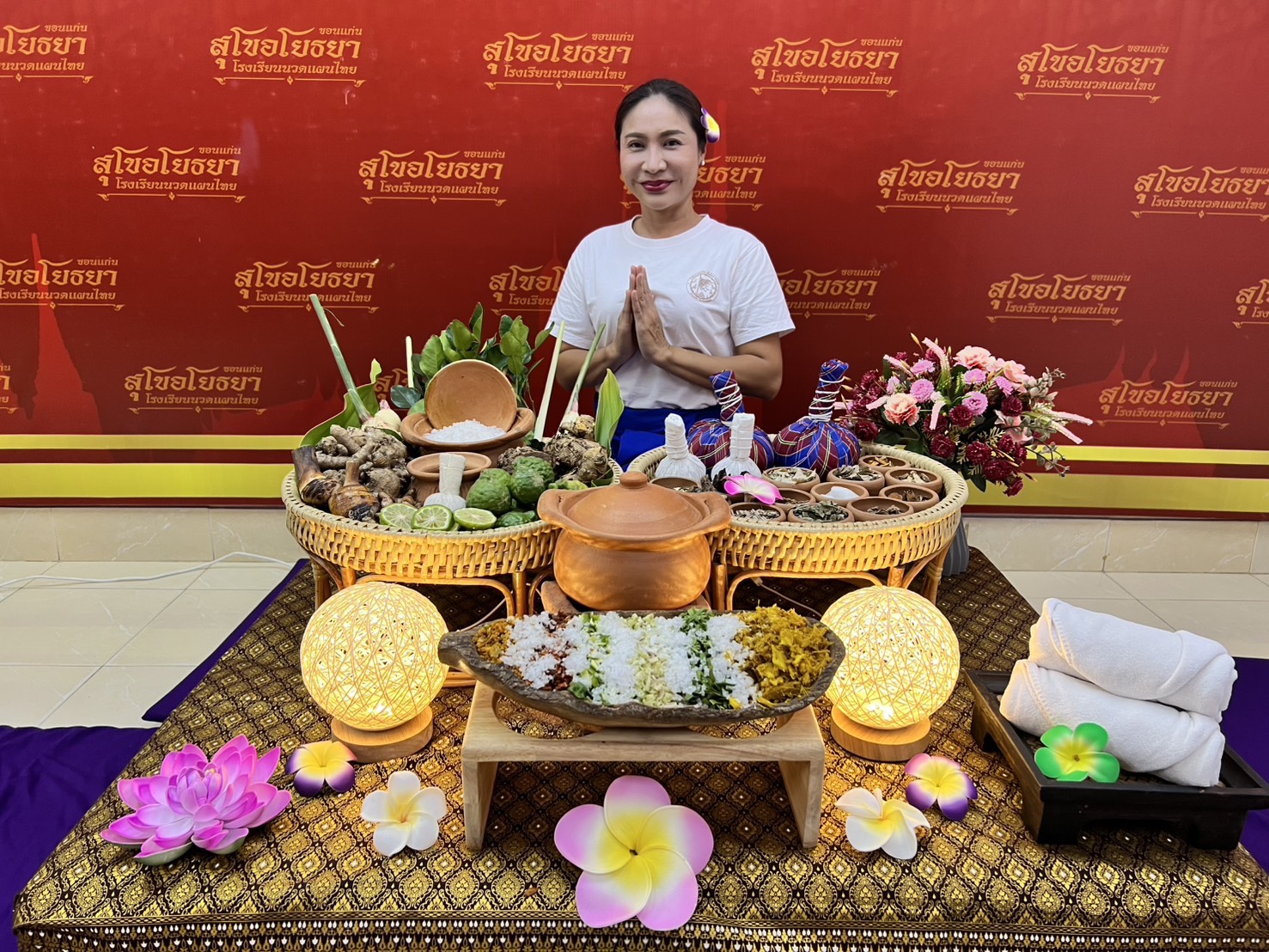 Postpartum care set with Thai herbs, herbal compress balls and clay pot