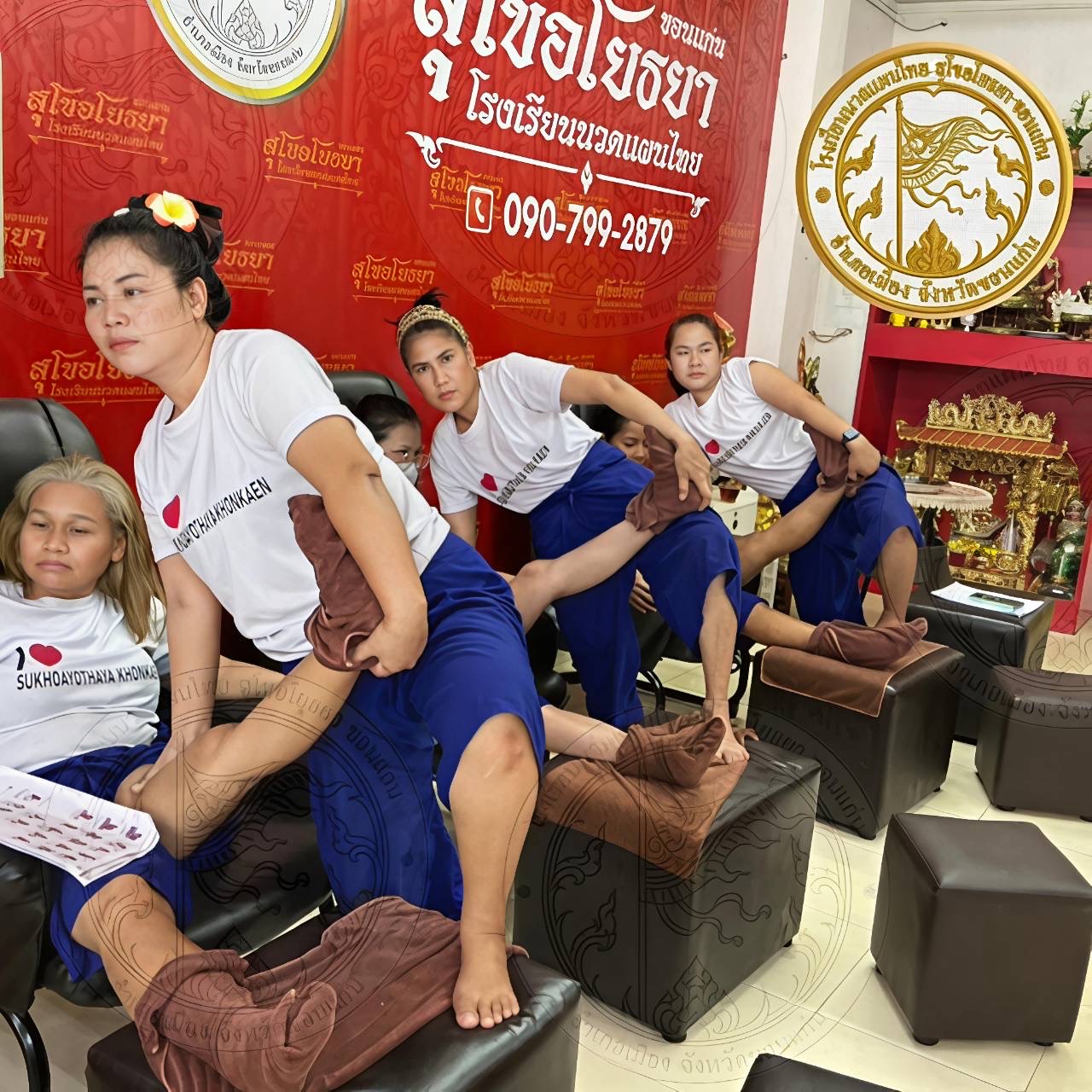 Practicing foot massage with a teacher's guidance